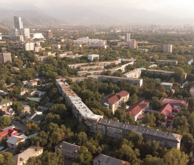 The vibrant city of Almaty, Kazakhstan, where modernity and tradition blend with stunning mountain views, from colourful street scenes to tranquil parks.