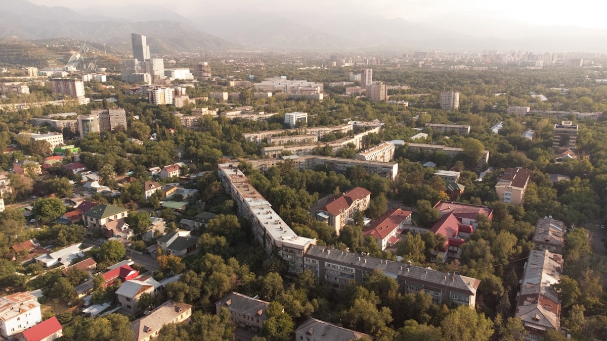 The vibrant city of Almaty, Kazakhstan, where modernity and tradition blend with stunning mountain views, from colourful street scenes to tranquil parks.